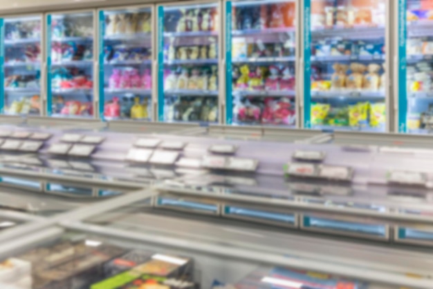 Refrigerators with chilled products in the supermarket Semifinished products and freezing Blurred