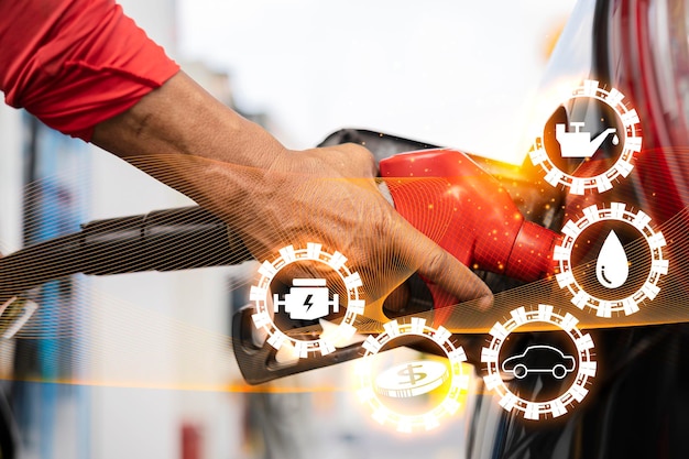 写真 ガソリンスタンドでガソリンスタンドで車に給油する男はガソリンスタンドでガソリンを車に給油して給油しました