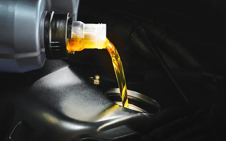 Photo refueling and pouring oil quality into the engine motor car transmission and maintenance
