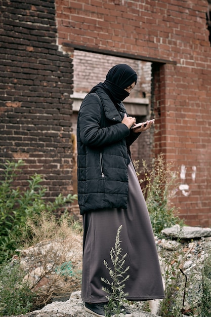 Refugee Woman Using Phone