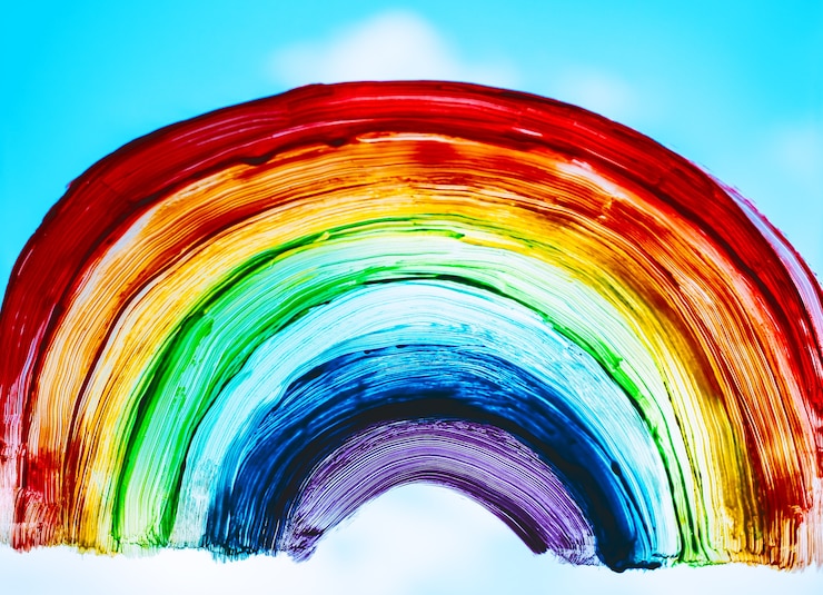 Foto regenboog op raam regenboog geschilderd met verf op glas is een symbool voor vele betekenissen