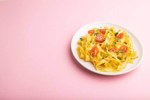 Reginelle semolina pasta with tomato, eggs and microgreen sprouts