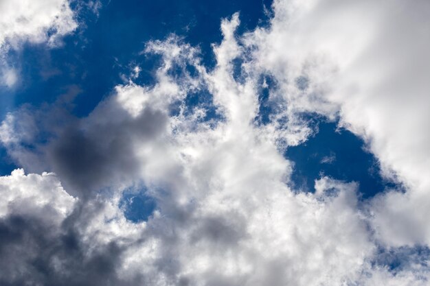 Regular spring clouds on blue sky at daylight in continental europe Close shot wit telehoto lens and polarizing filter