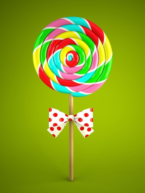 Reinbow lolly met strik op groene achtergrond