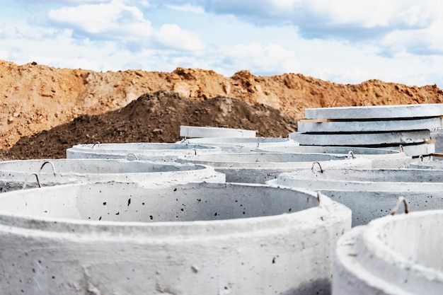 Reinforced concrete rings for the installation of underground wells at the construction site Reinforced concrete products for the device of underground communications Sewerage and plumbing