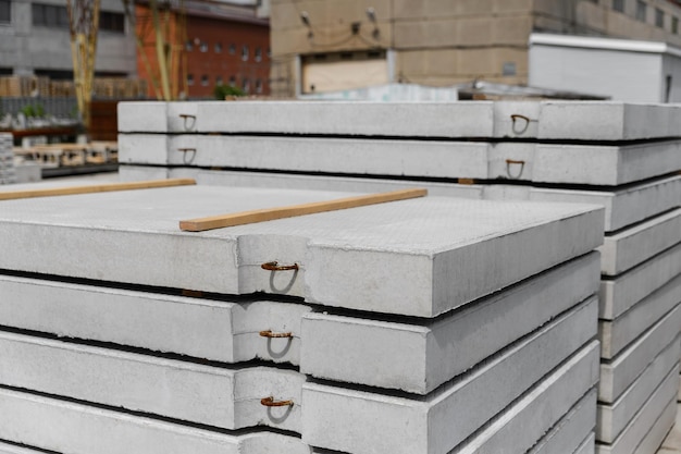 Reinforced concrete road slabs of highways stacked in a warehouse of a factory