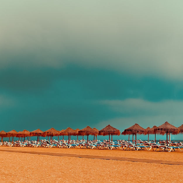 Relax. Beach. Beach chairs umbrellas on the ocean