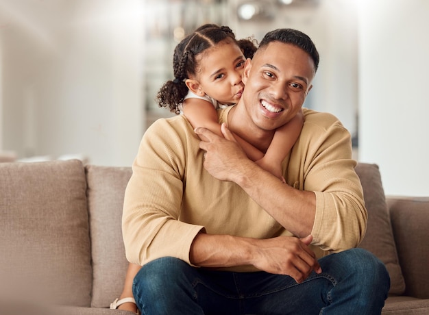 Relax love and daughter with father on sofa and hug for family happy and support together Lifestyle smile and portrait of dad and girl in living room at home for happiness youth and wellness