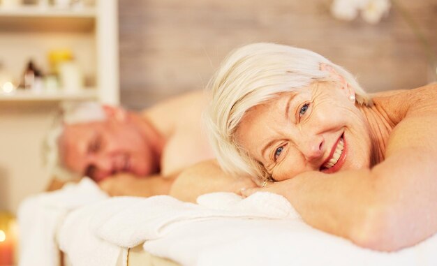 Photo relax portrait and senior couple at a spa for health wellness and back massage treatment calm beauty and closeup of zen elderly man and woman at retirement resort for self care at a natural salon