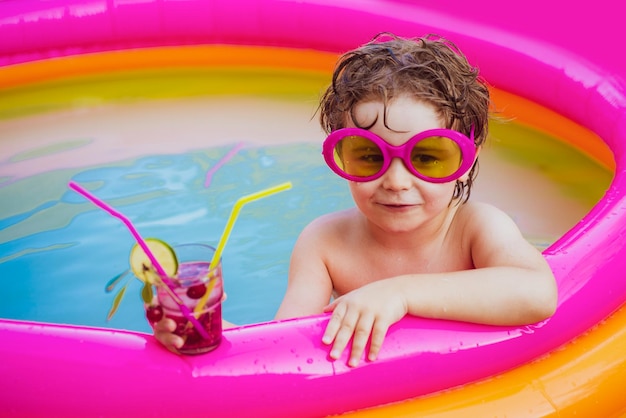 Relax in spa swimming pool Happy little boy relaxing in pool Little child boy having fun in the pool