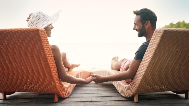 Photo relax travel and deck with couple holding hands at hotel resort for bonding luxury and summer vacation honeymoon happy and tropical with man and woman at bali villa for date holiday and mockup