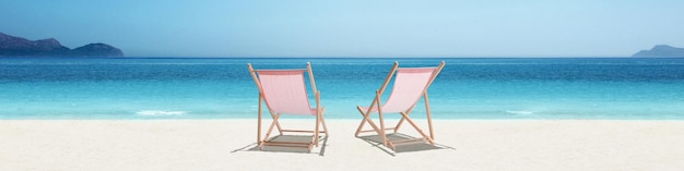 Relax on tropical beach in the sun on deck chairs