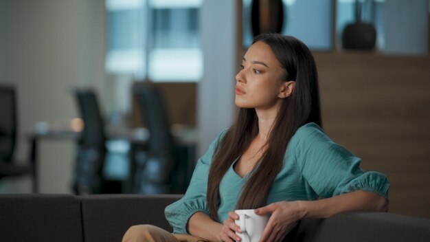 Relaxed ceo drinking tea enjoying in office closeup relaxed boss looking away