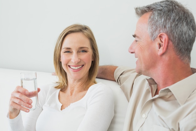 Relaxed couple with a glass of water