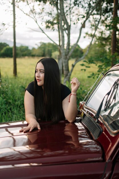 Relaxed girl on a car