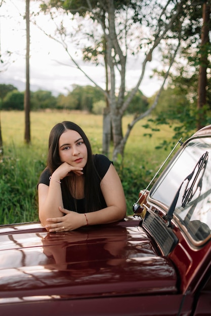 Relaxed girl on a car