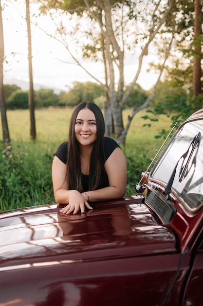 Relaxed girl on a car