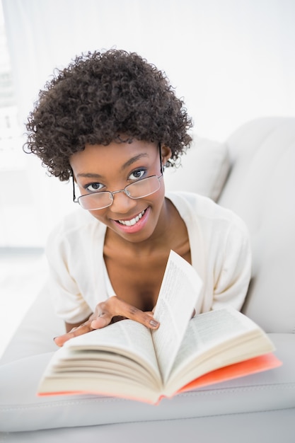 Relaxed gorgeous brunette reading book