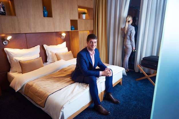 relaxed and happy young couple in modern hotel room