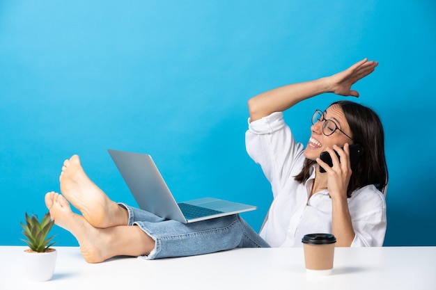 Relaxed hispanic woman talking on phone