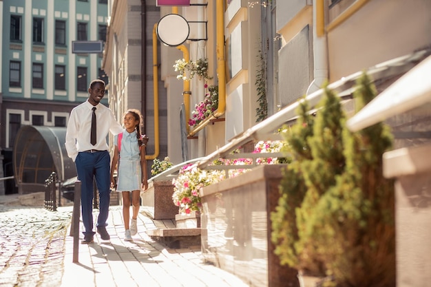 Relaxed international people enjoying warm days in city