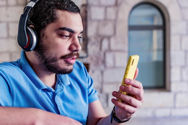 Relaxed man watching video at home