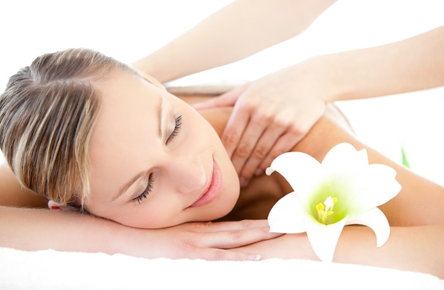 Relaxed woman receiving a back massage 