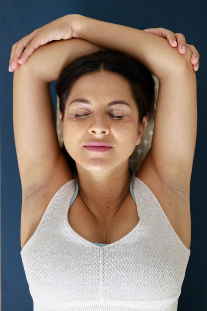 relaxed young woman doing yoga
