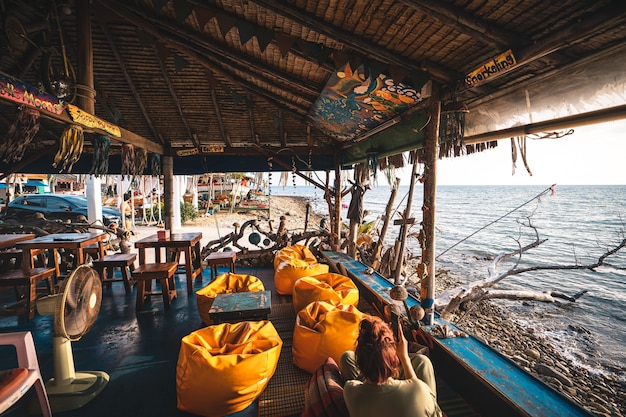 Relaxing cafe on the beach on the island in Evening