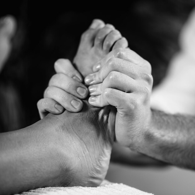 Relaxing foot massage in spa salon