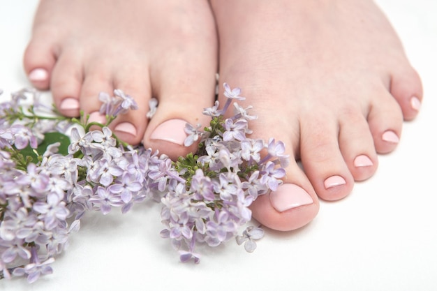 Relaxing nude pedicure with with delicate lilac