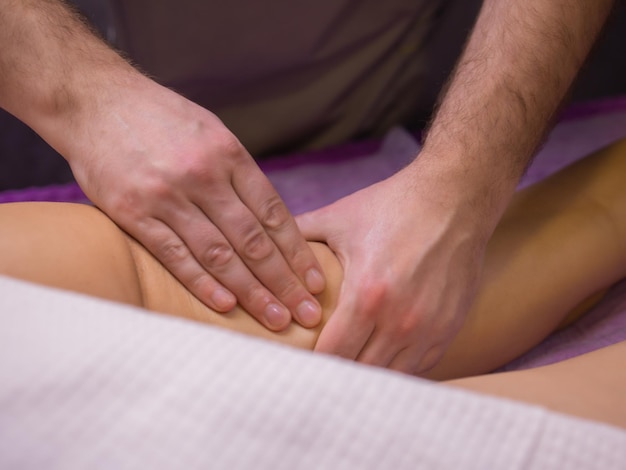 Relaxing pain fabulous full foot massageclose up side view cropped photo