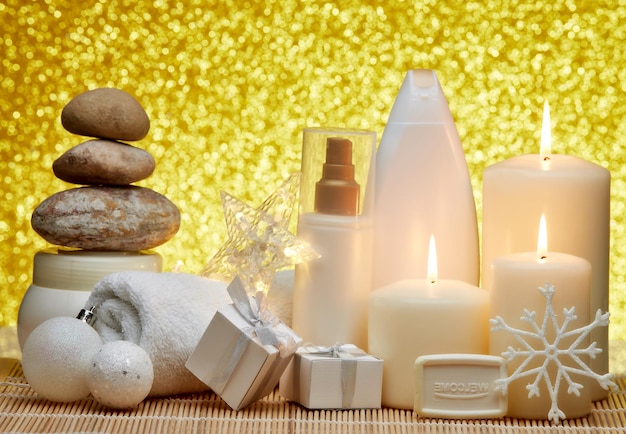 Photo relaxing spa scene with candles flowers and stones on wooden table in wellness center