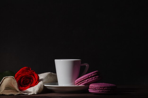 Relaxing with drinking a cup of coffee on wooden table.