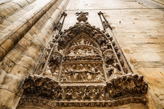 Relief on a religious theme on the wall in the duomo milan italy