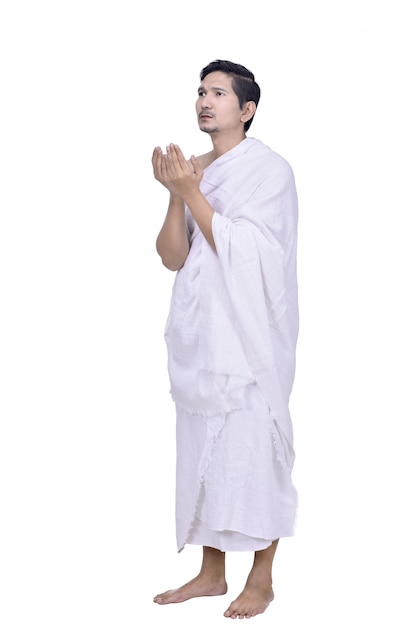 Religious asian muslim man with hajj dress pray 