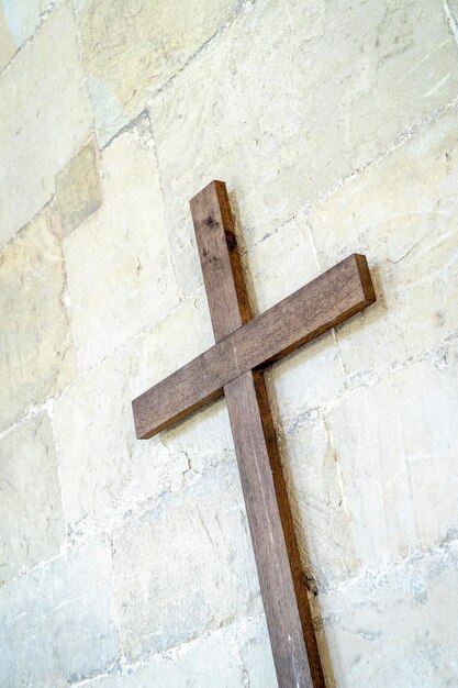 Religious cross against wall