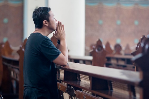 Religious man begging forgiveness in church