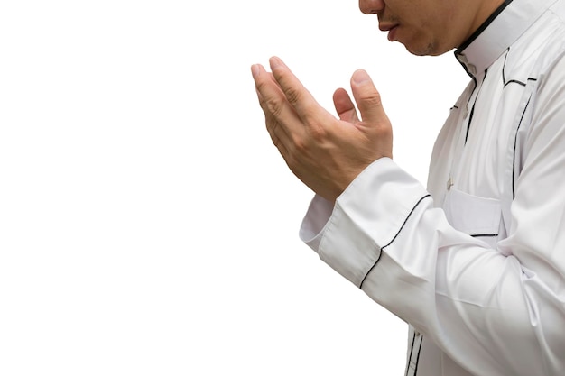 Religious muslim man praying inside the mosqueMen are praying their God Of IslamPut the pure white dress the two sides to the mouth Faith in Islamic White background