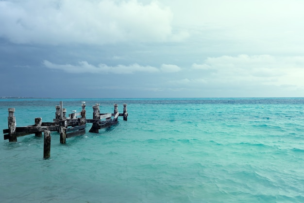 Remains of an old pier on playa caracol beach in cancun mexico