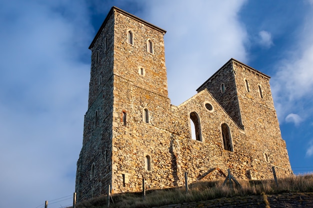 Remains of Reculver Church Towers Bathed in Late Afternoon Sun in Winte