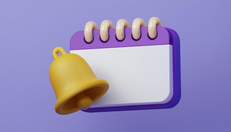 Photo a reminder bell next to a blank calendar