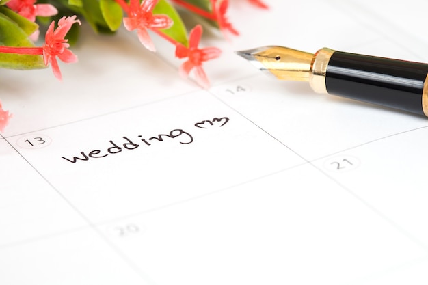 Reminder Wedding day in calendar with pen