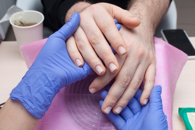 removal of gel polish for a man in the salon