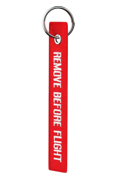 remove before flight tag on a white background