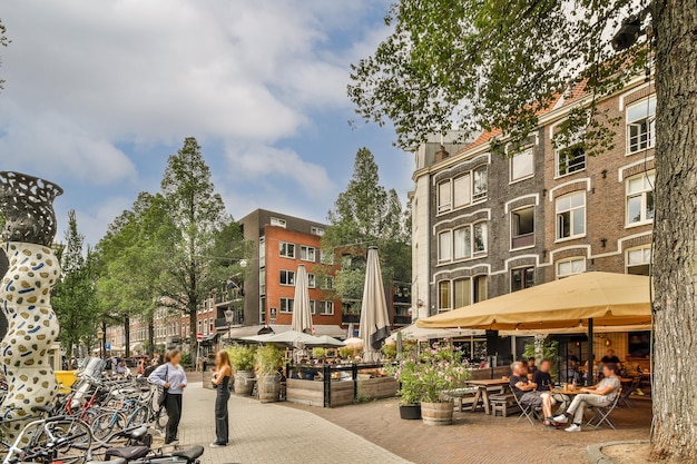 A rendering of a street with people sitting at tables