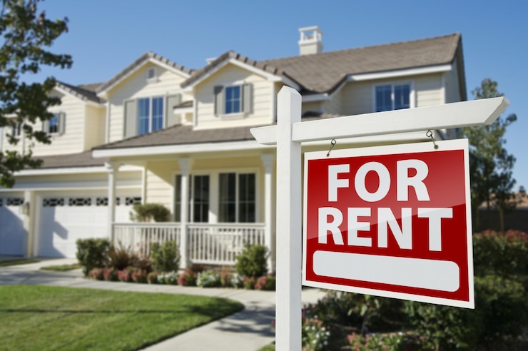 Photo for rent real estate sign in front of house