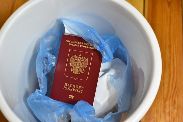 Renunciation of Russian citizenship travel ban Russian passport in trash can
