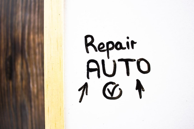 REPAIR AUTO text concept on white board with checkmark and arrows