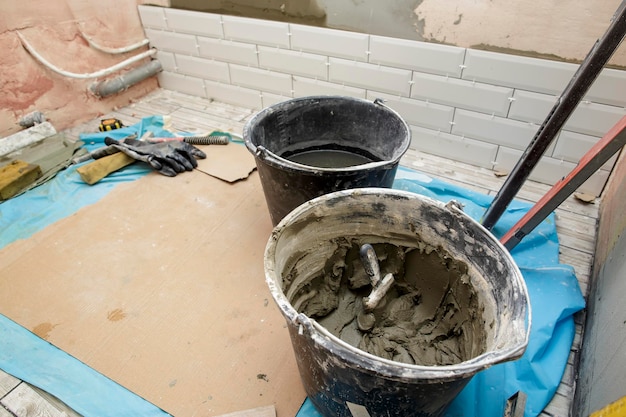 Repair in the bathroom Several rows of tiles are laid on the wall